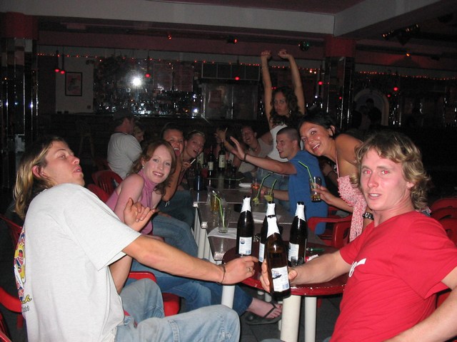 Greece: The table of random people on Matts b-day... the two guys in front had a disgusting threesome with the town whore that night