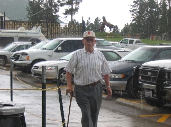 Grandpa Walking in Hellish Rain