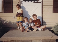 Drew and Little Sean and me with my weapons